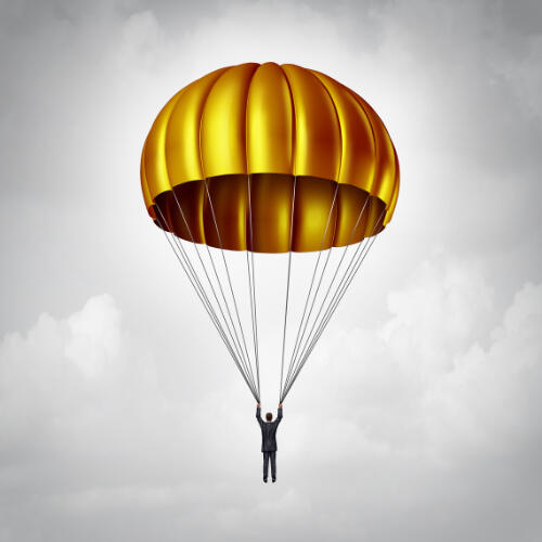 Illustration of a deployed golden parachute with the strings held by a male figure in a dark grey business suit against a grey cloudy background